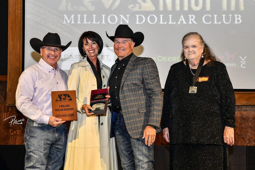 Garth and Amanda Gardiner of Gardiner Quarter Horses receiving NRCHA Two Million Dollar Breeders recognition